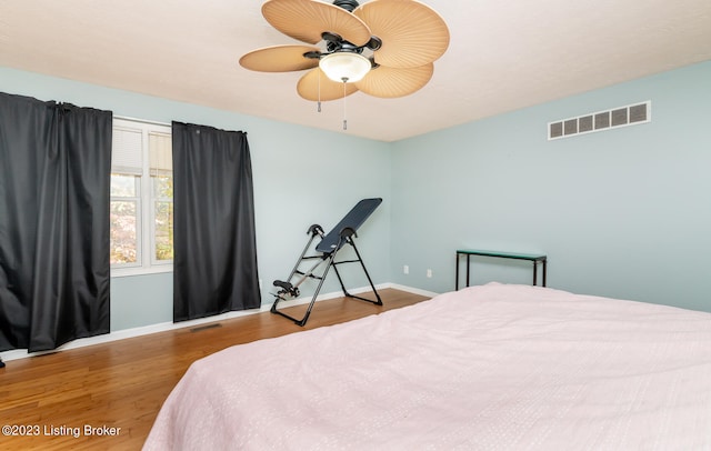 bedroom featuring wood-type flooring and ceiling fan