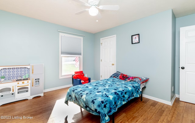 bedroom with ceiling fan and wood-type flooring