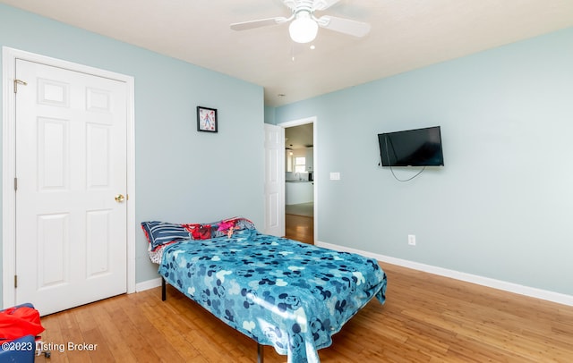 bedroom with wood-type flooring and ceiling fan