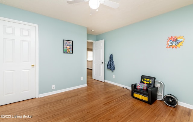 interior space featuring hardwood / wood-style floors and ceiling fan