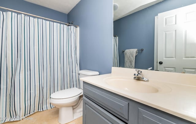 bathroom featuring vanity, toilet, a shower with shower curtain, and tile patterned flooring