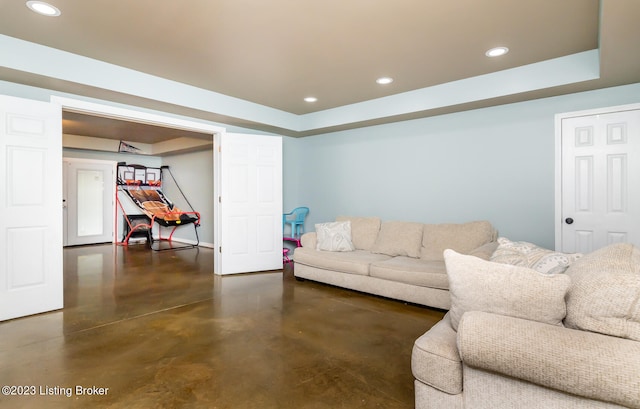 living room featuring a tray ceiling