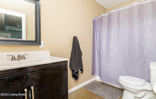 bathroom featuring vanity, toilet, walk in shower, and tile patterned floors