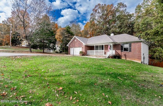 ranch-style house with a garage, a front lawn, and covered porch