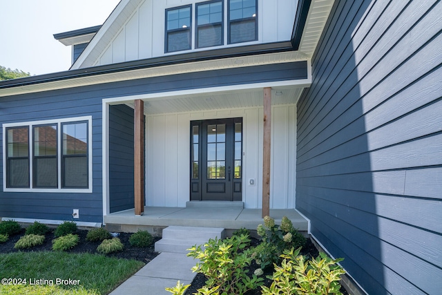 doorway to property with a porch