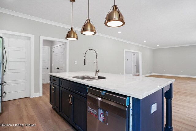 kitchen with light hardwood / wood-style flooring, appliances with stainless steel finishes, light stone counters, sink, and a kitchen island with sink