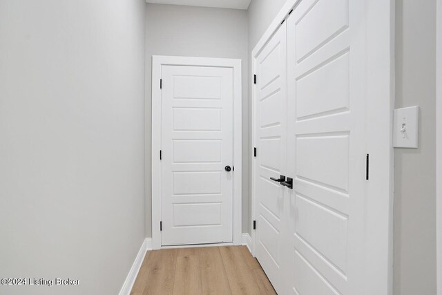 doorway to outside with light wood-type flooring