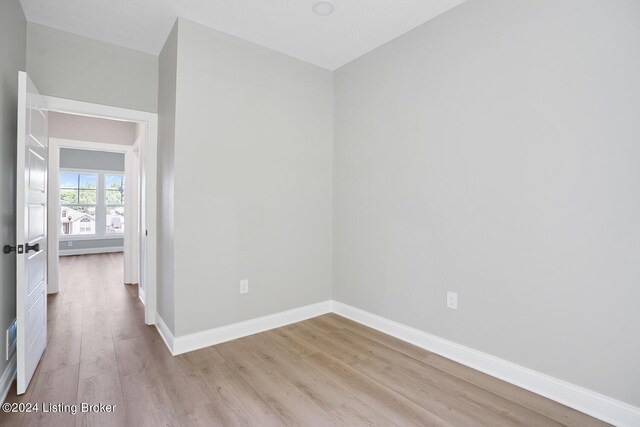 unfurnished room with light wood-type flooring