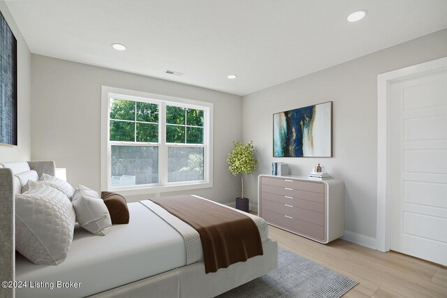 bedroom with light wood-type flooring