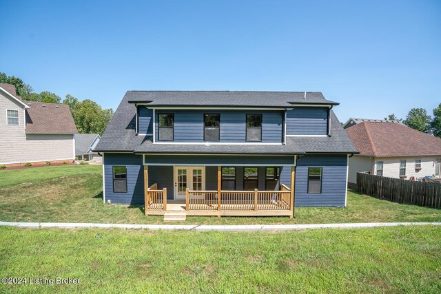 view of front property featuring a wooden deck and a front yard