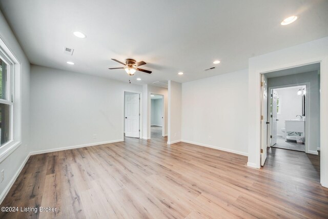 spare room featuring ceiling fan and light wood-type flooring