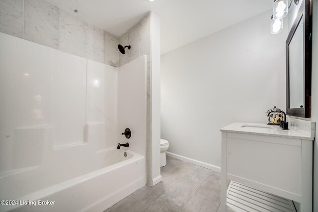 full bathroom featuring tile patterned floors, shower / washtub combination, vanity, and toilet