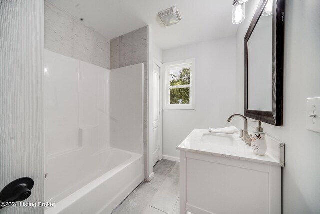 bathroom with vanity, tile patterned floors, and tub / shower combination