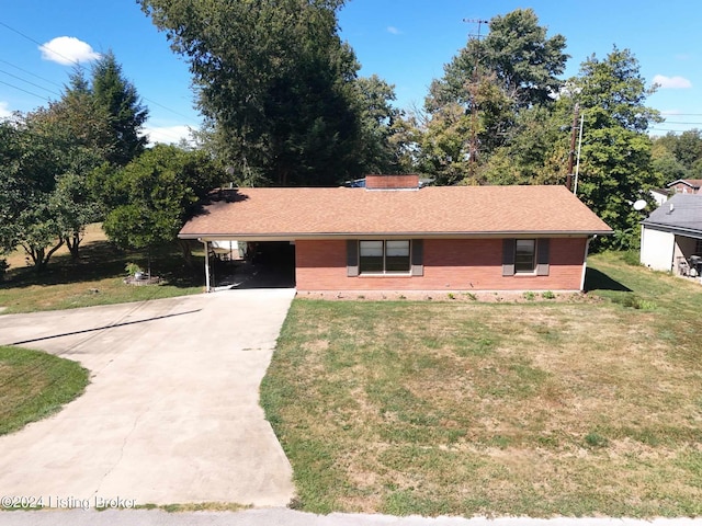 single story home with a carport and a front lawn