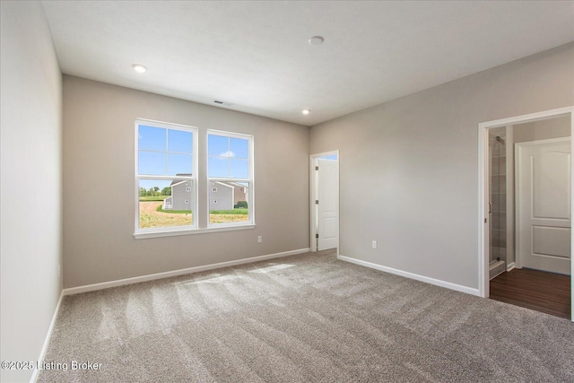 unfurnished bedroom with carpet floors, baseboards, and recessed lighting