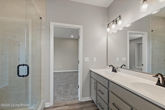 162 Harvest Point Way, Mt Washington, KY 40047 - full bathroom with a stall shower, wood finished floors, double vanity, and baseboards