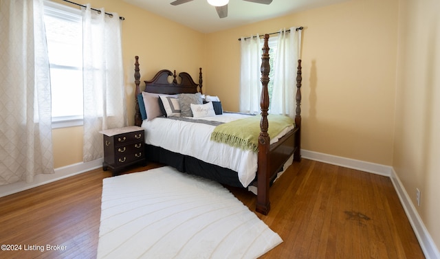 bedroom with wood-type flooring and ceiling fan