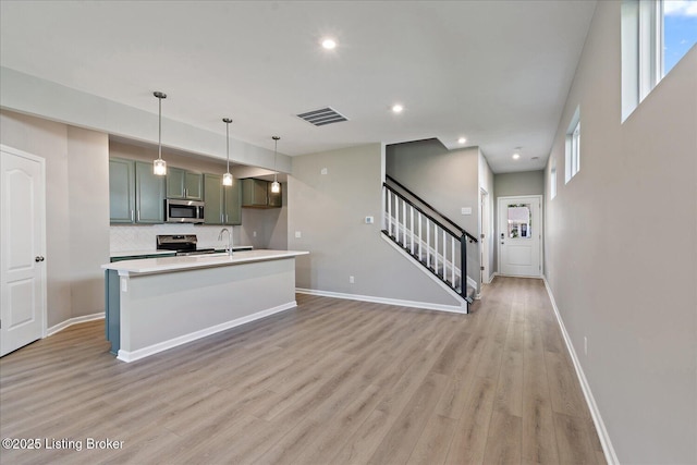 196 Harvest Moon Ct Unit 219A, Shepherdsville, KY 40165 - kitchen with stainless steel appliances, light wood-style flooring, light countertops, baseboards, and tasteful backsplash