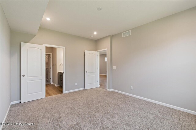 196 Harvest Moon Ct Unit 219A, Shepherdsville, KY 40165 - unfurnished bedroom featuring carpet floors, baseboards, recessed lighting, and ensuite bath
