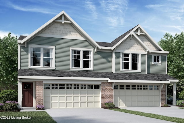 craftsman inspired home with an attached garage, brick siding, and driveway