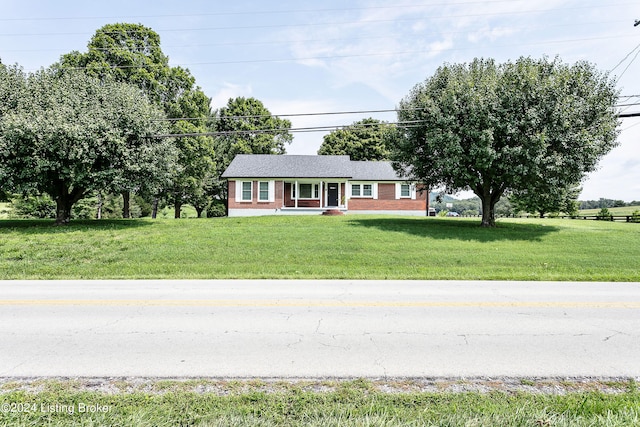 view of front of property with covered porch and a front lawn