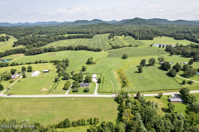 birds eye view of property featuring a rural view and a mountain view