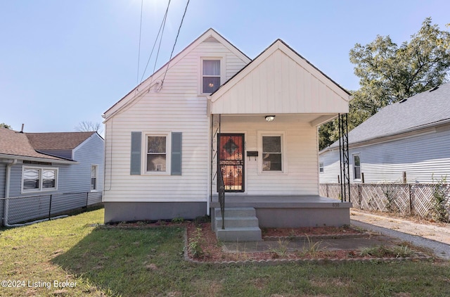 bungalow-style house featuring a front yard