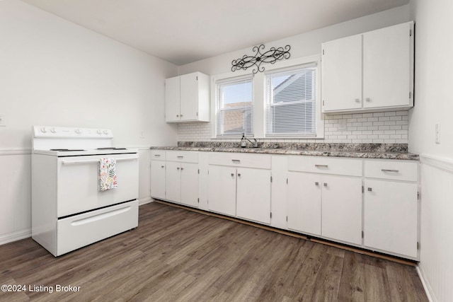 kitchen with dark hardwood / wood-style flooring, electric stove, decorative backsplash, and white cabinetry