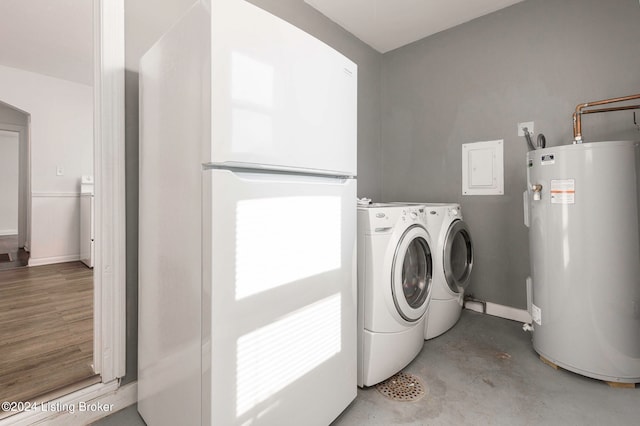 clothes washing area featuring washing machine and clothes dryer, electric panel, electric water heater, and light hardwood / wood-style floors