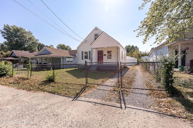 bungalow-style house with a front lawn