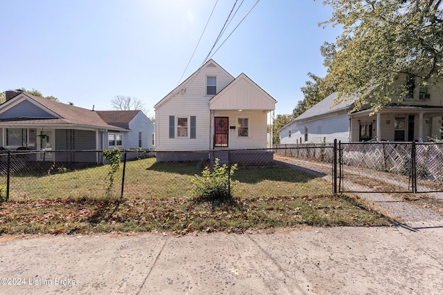 bungalow-style house with a front yard