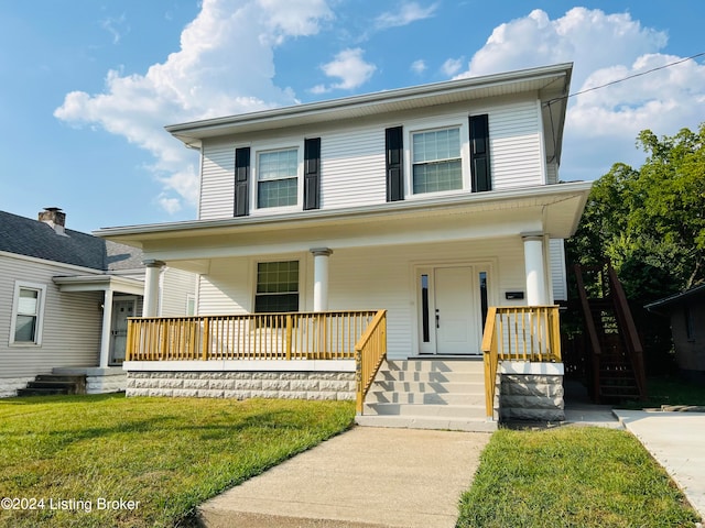 front facade featuring covered porch and a front lawn