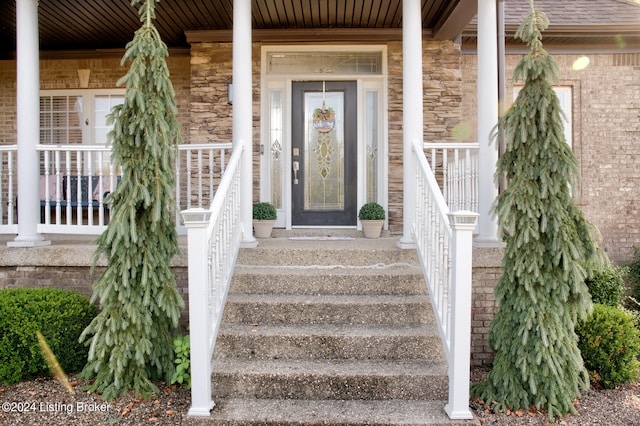 property entrance with covered porch