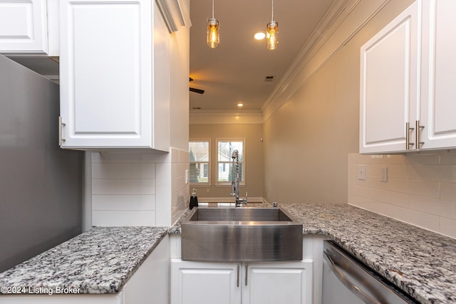 kitchen featuring dishwasher, backsplash, crown molding, sink, and white cabinets