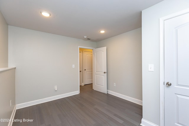 spare room featuring dark hardwood / wood-style floors