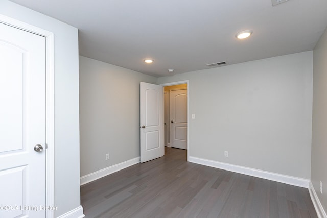 empty room featuring dark wood-type flooring