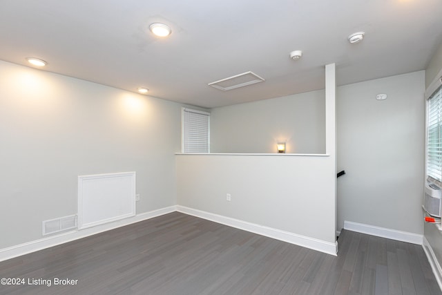 basement with dark wood-type flooring