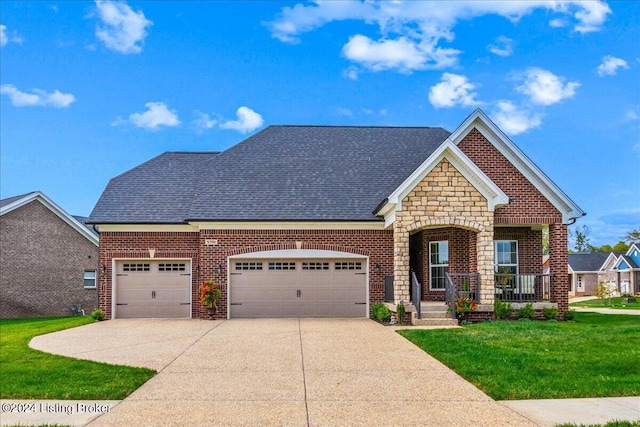 craftsman house featuring a garage, covered porch, and a front lawn