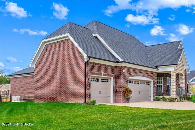 view of property exterior with a garage and a lawn