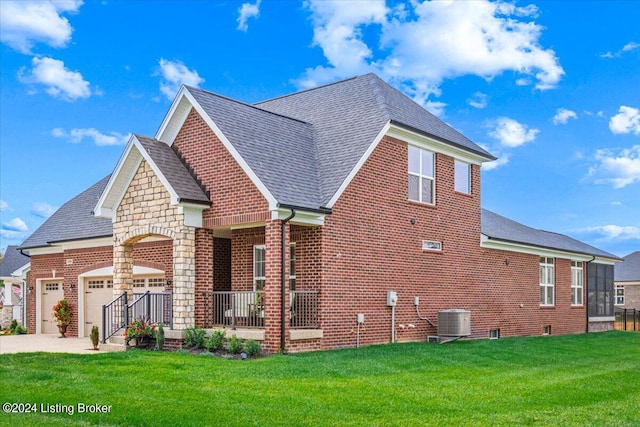 view of property exterior featuring a garage, a porch, cooling unit, and a lawn