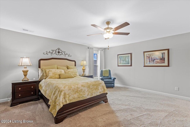 bedroom with ceiling fan and light colored carpet