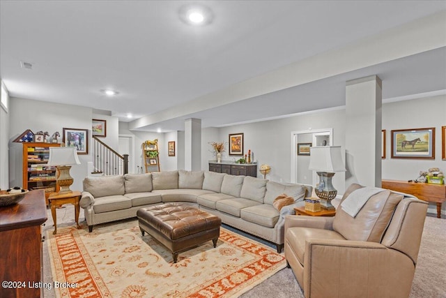 living room featuring decorative columns