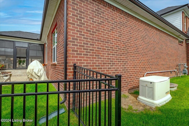 view of home's exterior with a lawn