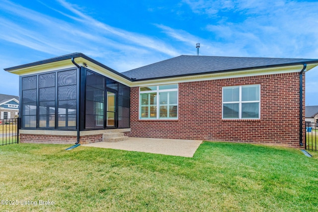 back of house with a patio, a sunroom, and a yard