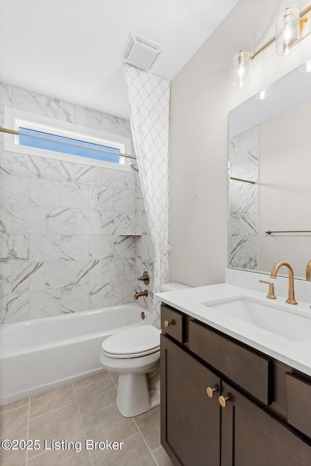 full bathroom with tiled shower / bath combo, vanity, a healthy amount of sunlight, and toilet