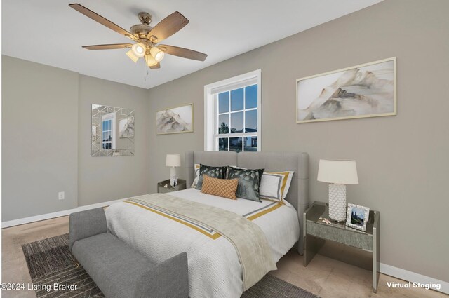 bedroom featuring ceiling fan and carpet