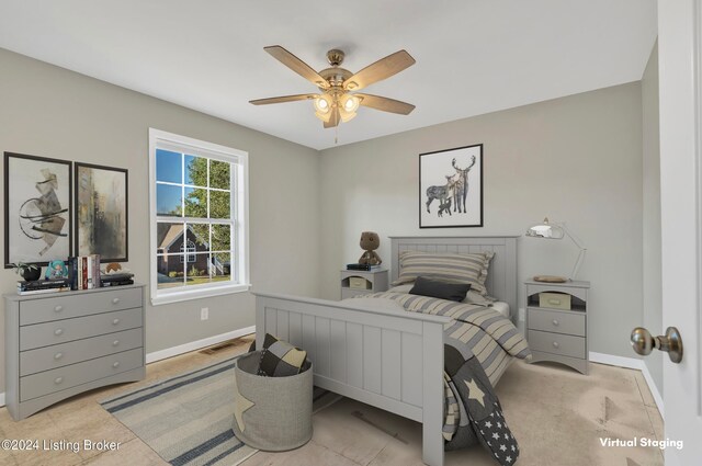 bedroom with light tile patterned floors and ceiling fan