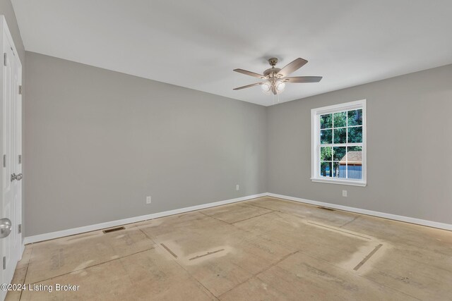 spare room with ceiling fan