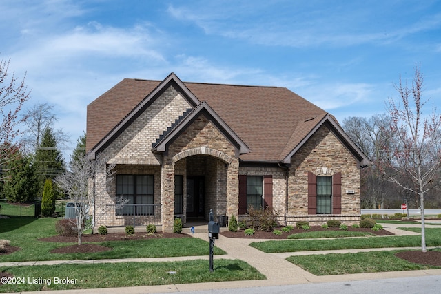 view of front of property with a front lawn