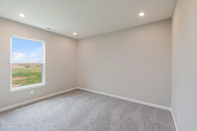 unfurnished room with carpet, baseboards, and recessed lighting